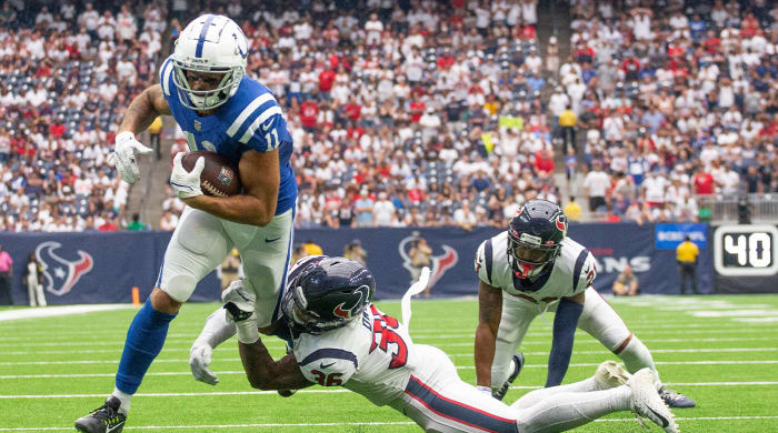 Sep 11, 2022; Houston, Texas, USA; Indianapolis Colts wide receiver Michael Pittman Jr. (11) scores a touchdown against Houston Texans Houston Texans safety Jonathan Owens (36) in the fourth quarter at NRG Stadium.
